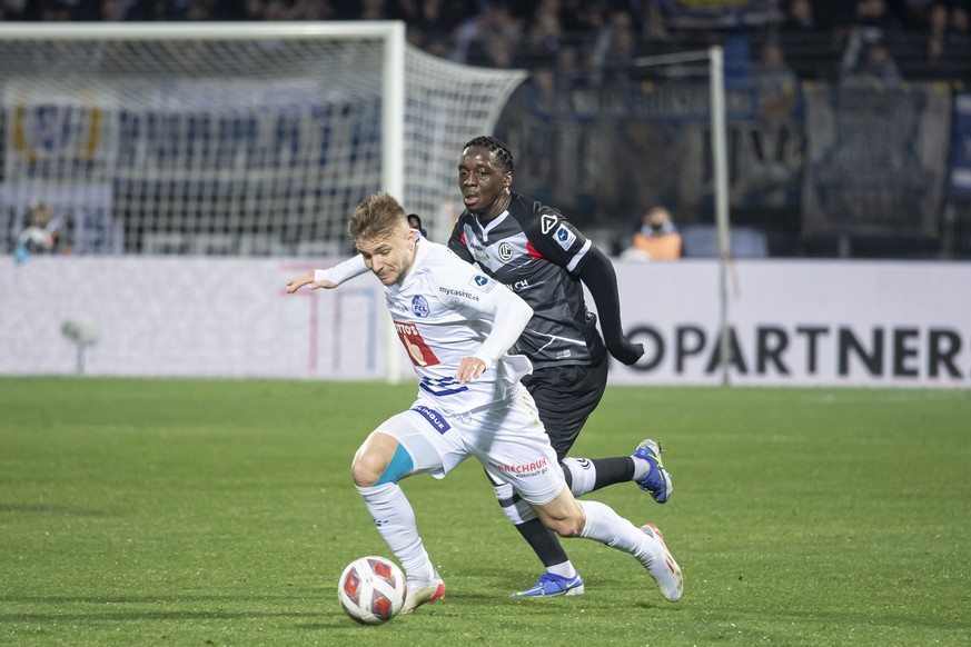 From left, Luzer&#039;s player Martin Frydek and Lugano ?s player Christopher Lungoyi, during the Super League soccer match FC Lugano against FC Lucern, at the Cornaredo stadium in Lugano, Sunday, Nov ...
