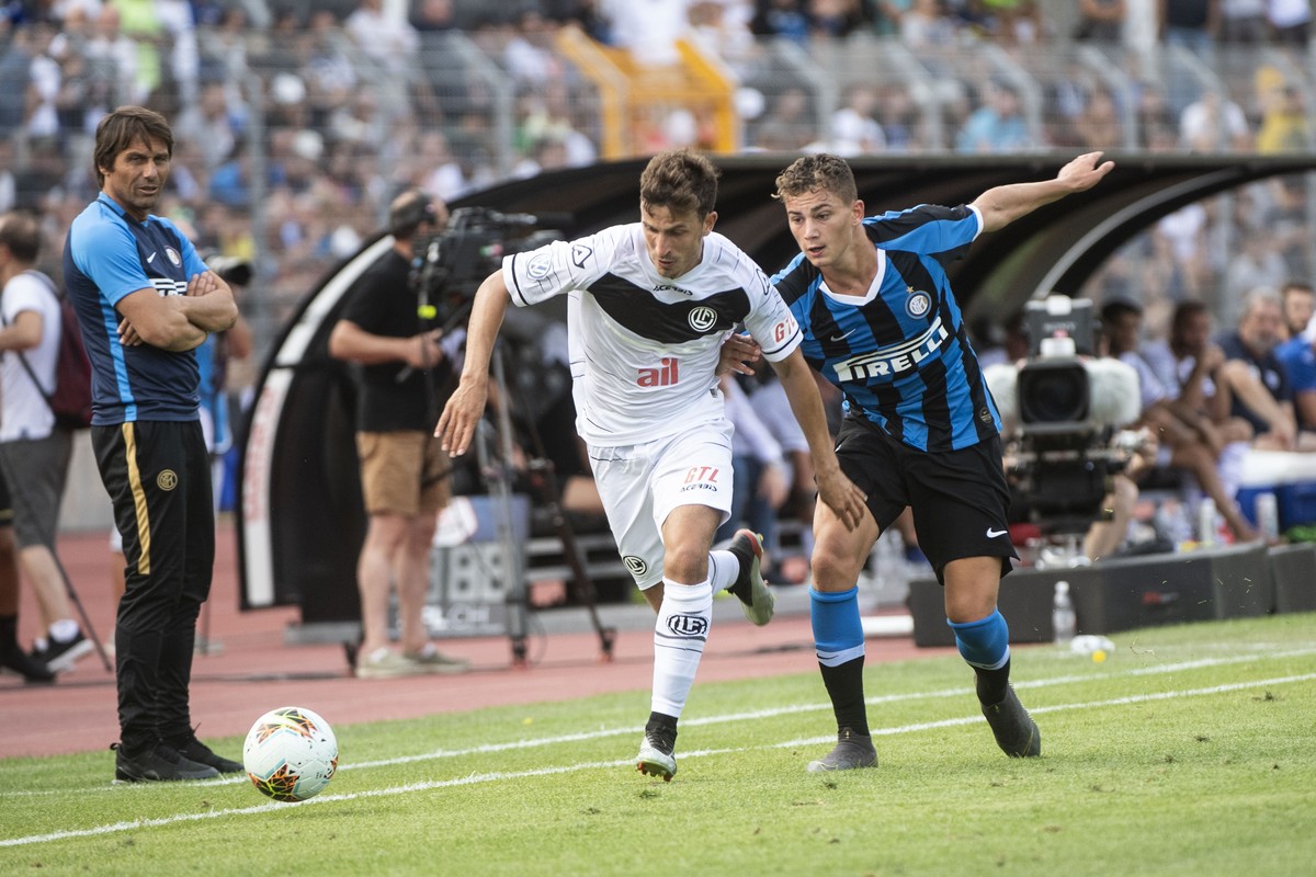 Olivier Custodio Lugano's Player and Sebastiano Esposito Inter's Player, from left, during a friendly soccer match between Switzerland's FC Lugano and Italy's Inter Milan, on Sunda ...