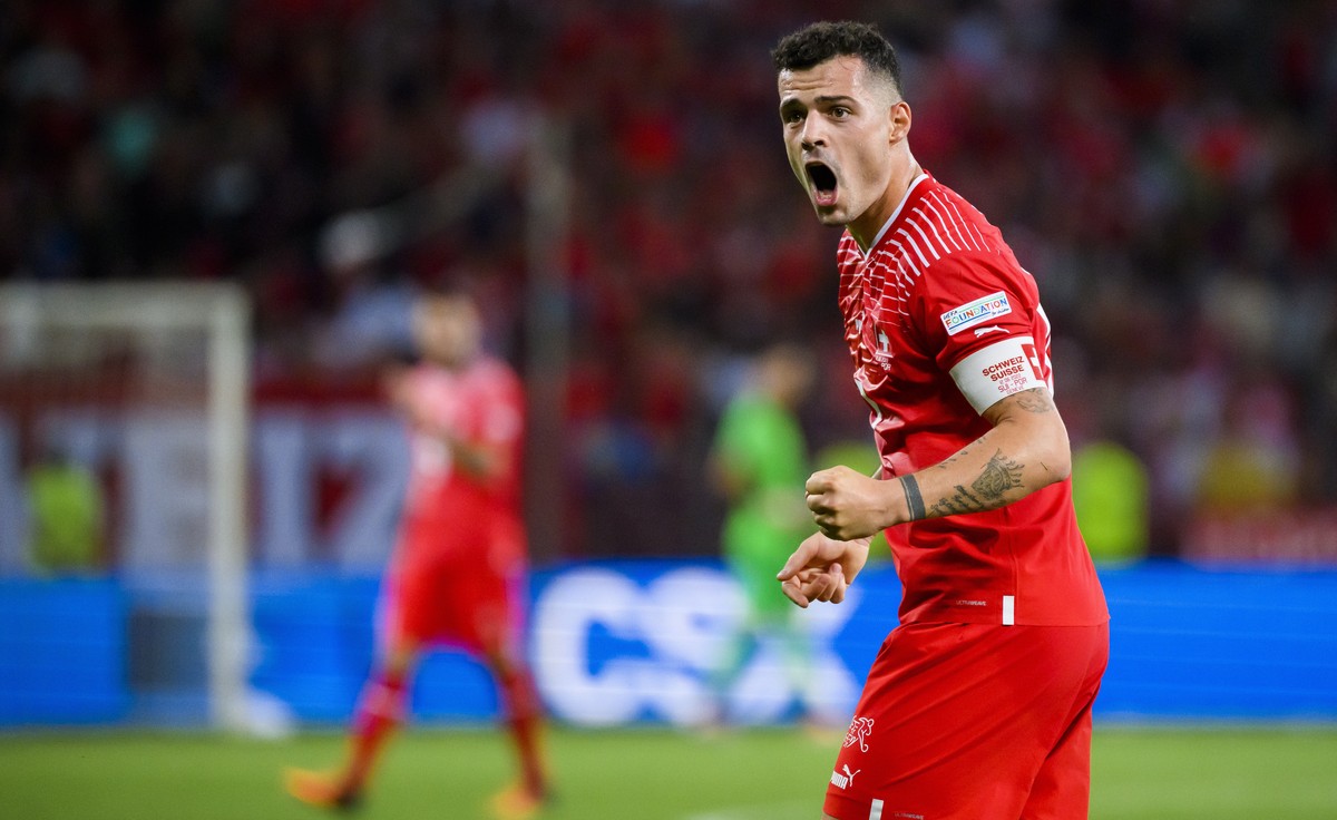 epa10010114 Switzerland's midfielder Granit Xhaka reacts during the UEFA Nations League soccer match between Switzerland and Portugal at the Stade de Geneve stadium, in Geneva, Switzerland, 12 Ju ...