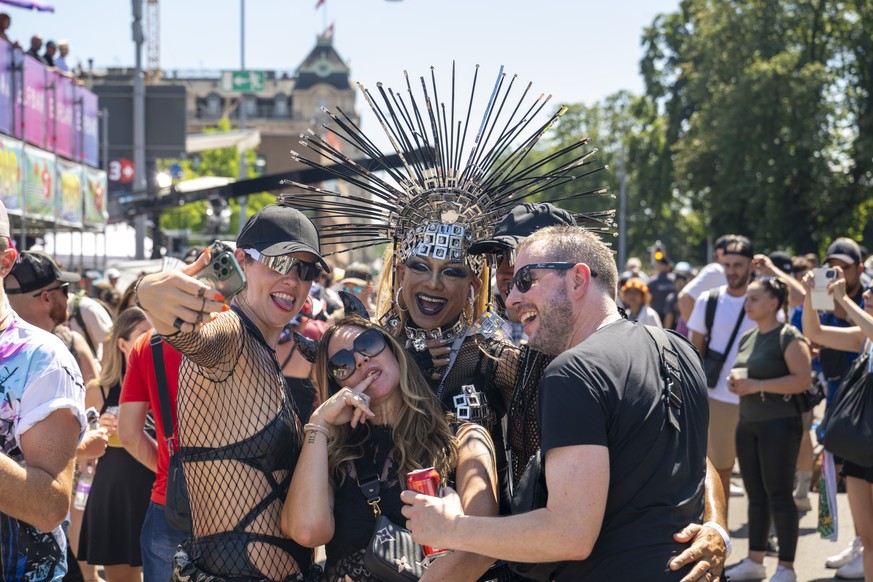 Participants dancing through the streets during the 31th Street Parade in the city center of Zurich, Switzerland, Saturday, August 10, 2024. The annual dance music event Street Parade runs this year u ...