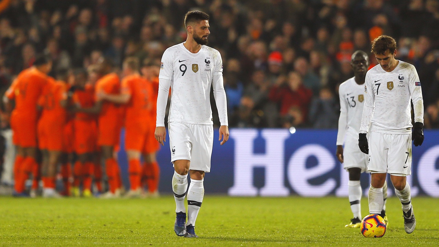 France&#039;s Olivier Giroud, left, and France&#039;s Antoine Griezmann, right, appear dejected as Netherlands players celebrate scoring their side&#039;s first goal during the international friendly  ...