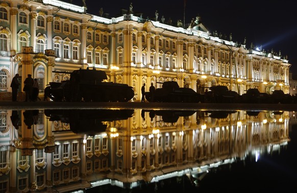 2016 AP YEAR END PHOTOS - People walk past World War II tanks at Dvortsovaya (Palace) Square in St.Petersburg, Russia, in the early morning at the time Nazi Germany attacked the Soviet Union 75 years  ...