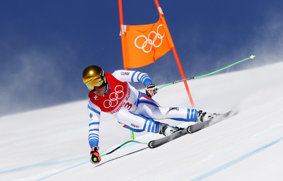 epa09726523 Johan Clarey of France in action during the 2nd training run for the Men&#039;s Downhill race of the Alpine Skiing events of the Beijing 2022 Olympic Games at the Yanqing National Alpine S ...