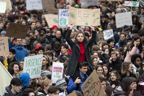 Thousands of students demonstrate during a &quot;Climate strike&quot; protest in Lausanne, Switzerland, Friday, March 15, 2019. Students from several countries worldwide plan to skip class Friday in p ...