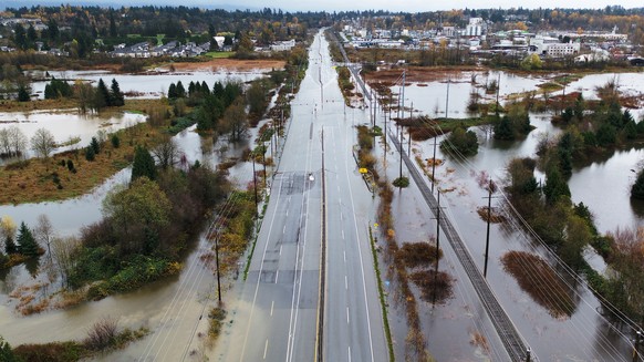 epa09587738 A handout photo made available by the Ministry of Transportation and Infrastructure showing flooding on BC Highway 11 caused by days of rain near Abbotsford, British Columbia, Canada, 14 N ...