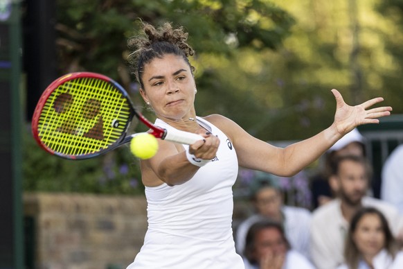 Jasmine Paolini of Italy hits a return during her second round match against Viktorija Golubic of Switzerland, at the Wimbledon All England Lawn Tennis Championships AELTC in London, on Thursday, July ...