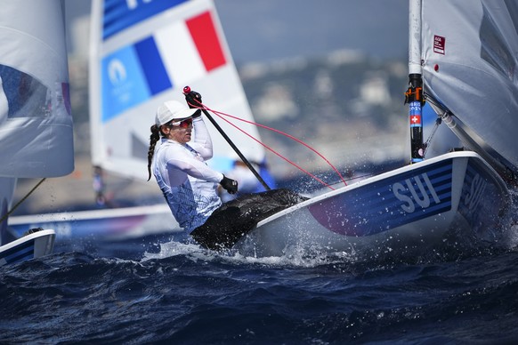 Maud Jayet of Switzerland competes in the women&#039;s dinghy race during the 2024 Summer Olympics, Sunday, Aug. 4, 2024, in Marseille, France. (AP Photo/Daniel Cole)