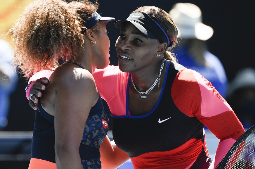 Japan's Naomi Osaka, left, is congratulated by United States' Serena Williams after winning their semifinal match at the Australian Open tennis championship in Melbourne, Australia, Thursday, Feb. 18, ...