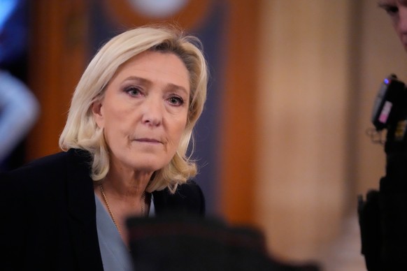 Far-right leader Marine Le Pen, left, walks outside the courtroom during a short break in her appeals trial in Paris, Tuesday, Jan. 20, 2026. (AP Photo/Michel Euler)
Marine Le Pen
