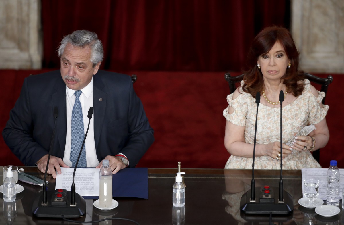 Argentina's President Alberto Fernández, left, delivers his annual State of the Nation address which marks the opening session of Congress, next to Vice President Cristina Fernandez de Kirchner i ...