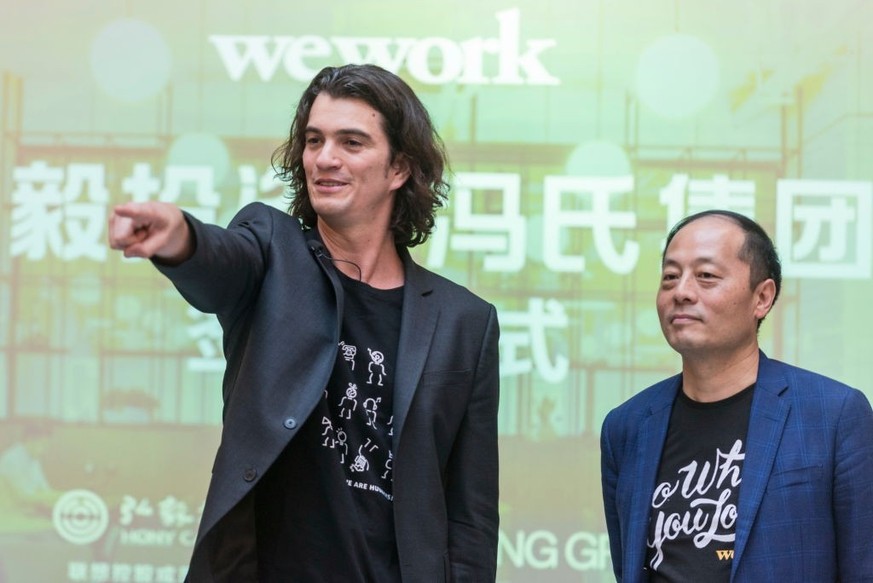 SHANGHAI, CHINA - APRIL 12: (L - R) Adam Neumann, co-founder chief executive officer of WeWork, and John Zhao, chief executive officer of Hony Capital Ltd., attend a signing ceremony at WeWork Weihai  ...
