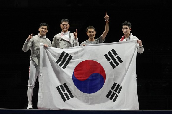 South Korea team fencers celebrate after winning a the men&#039;s Sabre team medal at the 2020 Summer Olympics, Wednesday, July 28, 2021, in Chiba, Japan. (AP Photo/Andrew Medichini)