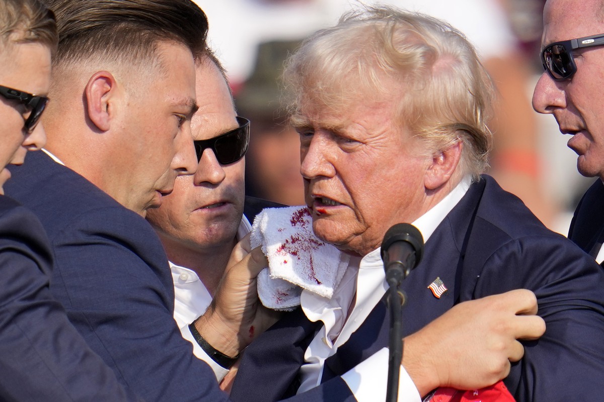 Republican presidential candidate former President Donald Trump is surrounded by U.S. Secret Service at a campaign event in Butler, Pa., on Saturday, July 13, 2024. (AP Photo/Gene J. Puskar)
Election  ...