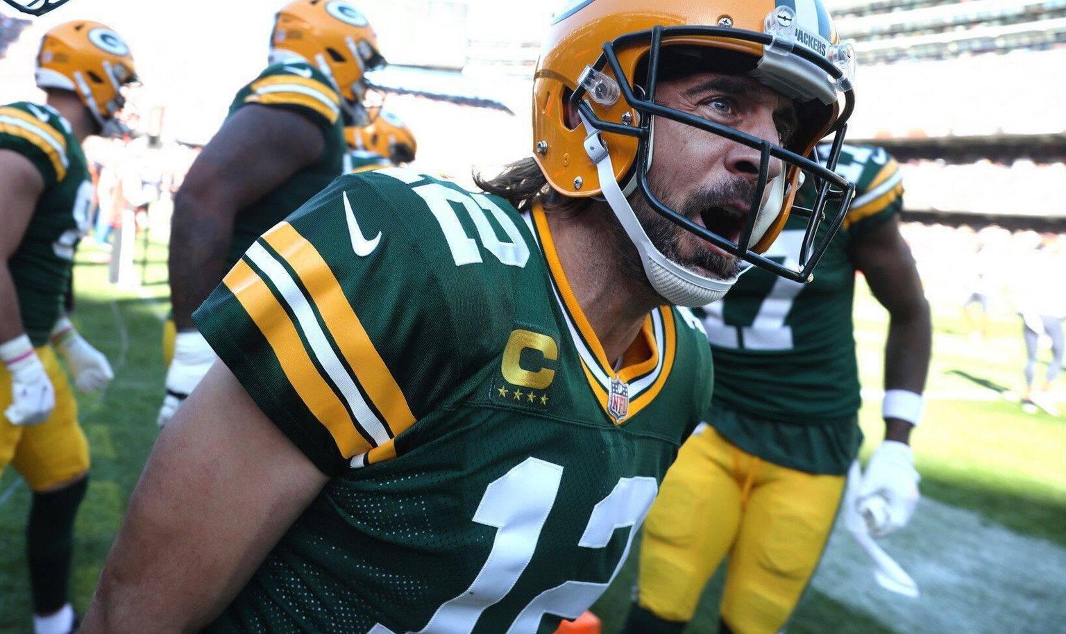 October 17, 2021: Green Bay Packers quarterback Aaron Rodgers celebrates with his teammates after rushing for a touchdown in the fourth quarter against the Chicago Bears at Soldier Field on Sunday, Oc ...