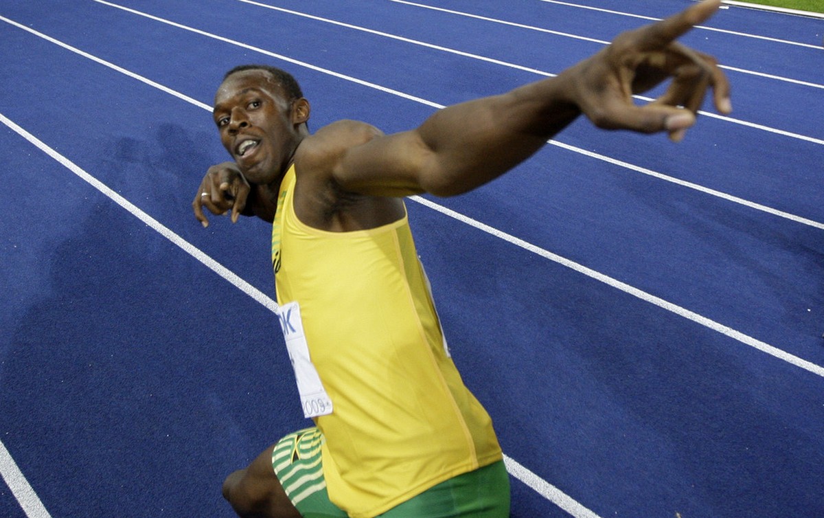 Jamaica's Usain Bolt celebrates setting a new 100m World Record after the final of the Men's 100m during the World Athletics Championships in Berlin on Sunday, Aug. 16, 2009. (AP Photo/David ...