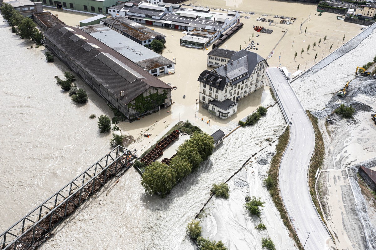 A view of the Rhone river, at left, and the Navizence river overflowing in the industrial zone that produces aluminium "Constellium," following the storms that caused major flooding, in Chip ...