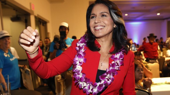 FILE - In this Nov. 6, 2018, file photo, Rep. Tulsi Gabbard, D-Hawaii, greets supporters in Honolulu. Gabbard has announced she’s running for president in 2020. The 37-year-old Gabbard said in a CNN i ...