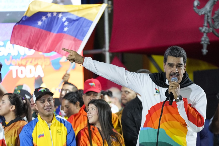 President Nicolas Maduro speaks to pro-government supporters after a referendum regarding Venezuela&#039;s claim to the Essequibo, a region administered and controlled by Guyana, in Caracas, Venezuela ...