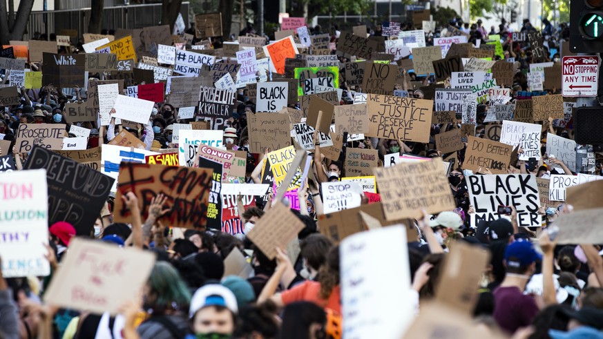 epa08463899 Protesters rally during a huge demonstration with thousands of people near City Hall over the arrest in Minnesota of George Floyd, who later died in police custody, in Los Angeles, Califor ...