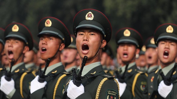 BEIJING, CHINA - OCTOBER 01: Soldiers of the People s Liberation Army prepare for a military parade marking the 70th anniversary of the founding of the People s Republic of China PRC at Tiananmen Squa ...