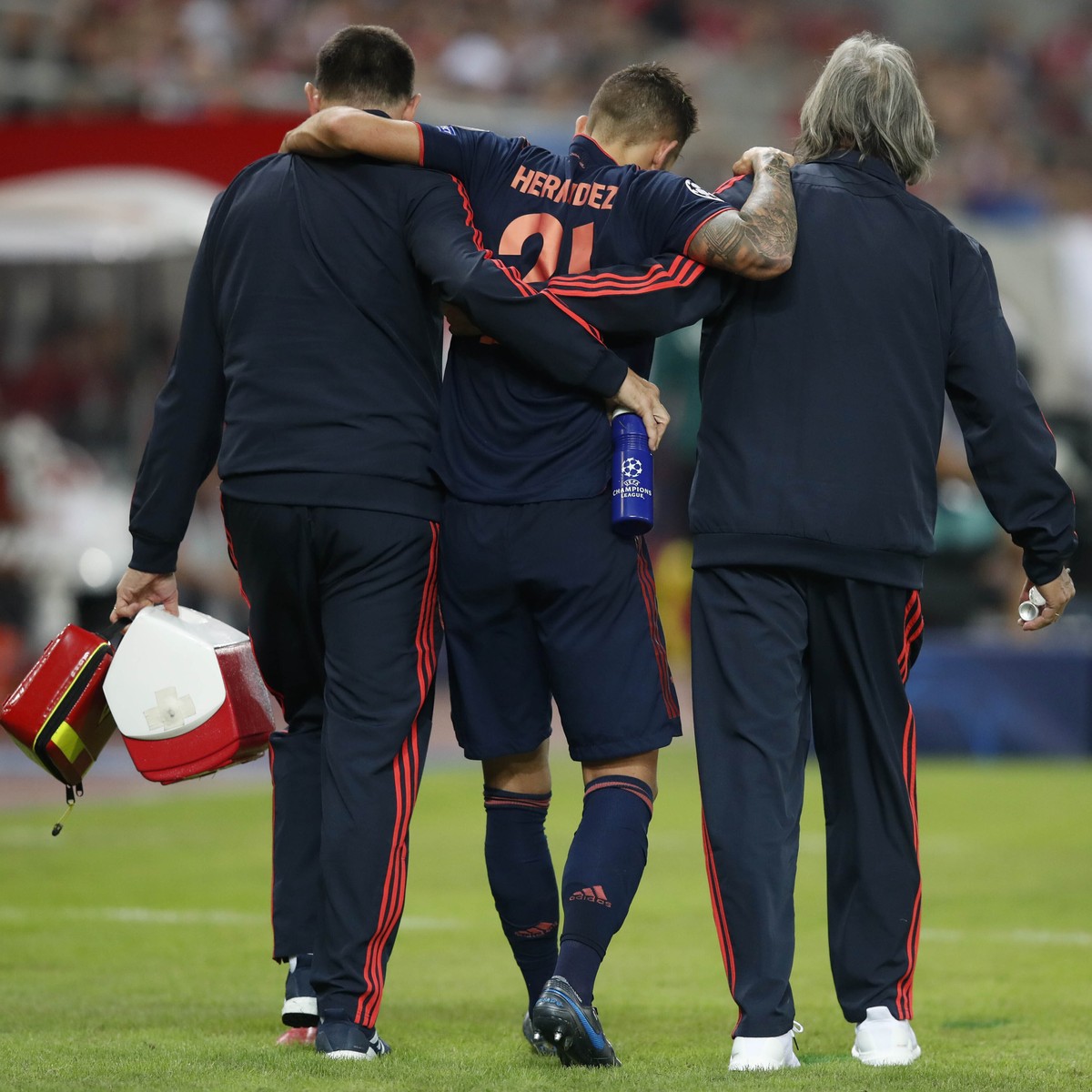 Bayern's injured Lucas Hernandez leaves the field during the Champions League group B soccer match between Olympiakos and Bayern Munich at the Georgios Karaiskakis stadium, in Piraeus port, near  ...