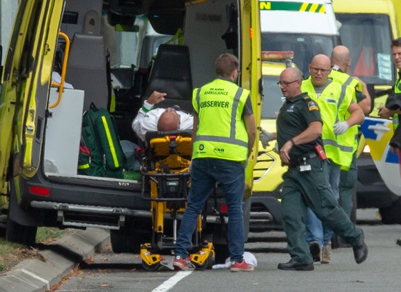 epa07438080 An injured person is loaded in an ambulance following a shooting resulting in multiple fatalies and injuries at the Masjid Al Noor on Deans Avenue in Christchurch, New Zealand, 15 March 20 ...