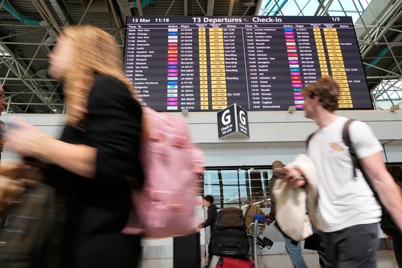 Passengers walk past a flight information display at Rome's Leonardo Da Vinci International airport in Fiumicino, Friday, Match 13, 2026. (AP Photo/Gregorio Borgia)
Alessandro Fusco