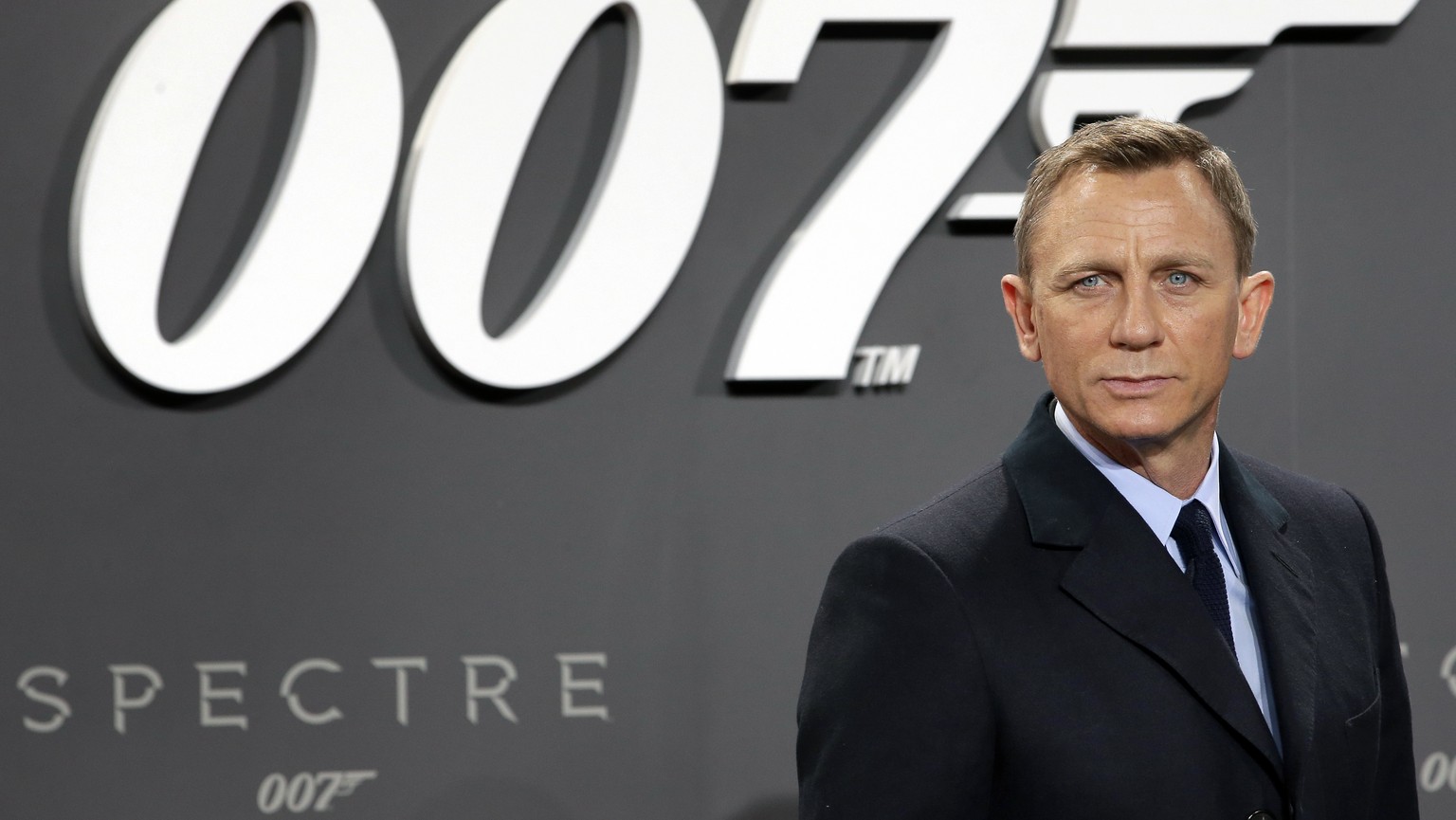 FILE - This is a Wednesday, Oct. 28, 2015 file photo of actor Daniel Craig poses for the media as he arrives for the German premiere of the James Bond movie &quot;Spectre&quot; in Berlin, Germany. The ...