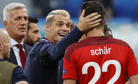 epa09318644 Granit Xhaka (C) of Switzerland talks to team mate Fabian Schaer during a break in the UEFA EURO 2020 quarter final match between Switzerland and Spain in St.Petersburg, Russia, 02 July 20 ...
