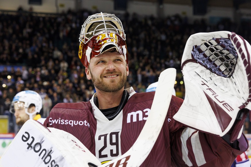 Geneve-Servette&#039;s goaltender Robert Mayer smiles after their victory against the team Zug, during the Fifth leg of the National League Swiss Championship semifinal playoff game between Geneve-Ser ...