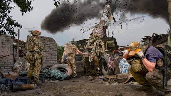 In this photo released by the Russian Defense Ministry Press Service on Tuesday, June 25, 2024, Russian soldiers fire the 152-mm howitzer &quot;Msta-B&quot; in an undisclosed location in Ukraine. (Rus ...