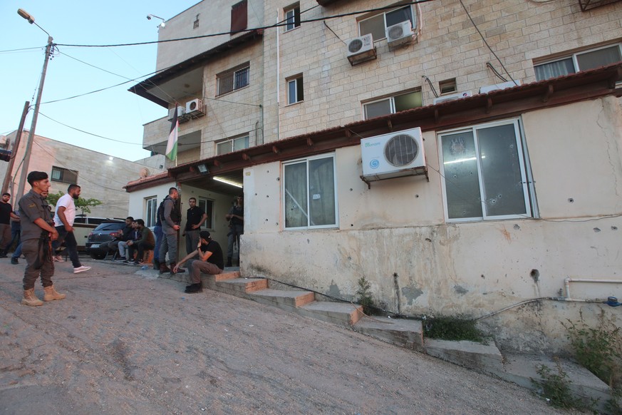 epa07640086 Palestinian security officials check the damage at the headquarters of Palestinian Preventive Security, in Nablus, the West Bank, 11 June 2019. According to Palestinian sources, Israeli tr ...