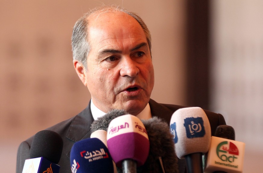 epa05340078 Jordanian Prime Minister Hani Mulki speaks to reporters after the swearing-in ceremony for the new cabinet at Ragadan Royal Palace, Amman, Jordan, 01 June 2016. The new prime minister and  ...