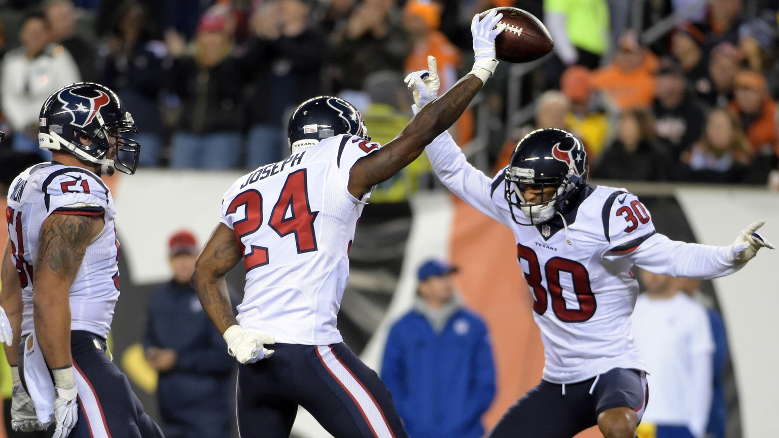 Nov 16, 2015; Cincinnati, OH, USA; Houston Texans cornerback Johnathan Joseph (24) celebrates with strong safety Andre Hal (29), defensive back Darryl Morris (21) and strong safety Kevin Johnson (30)  ...