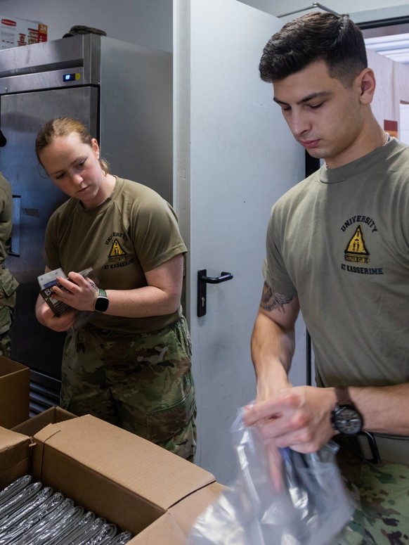 RECORD DATE NOT STATED U.S. Army Combat Medic Specialists assigned to Task Force Orion, 27th Infantry Brigade Combat Team, New York Army National Guard assemble individual first-aid kits for Soldiers  ...