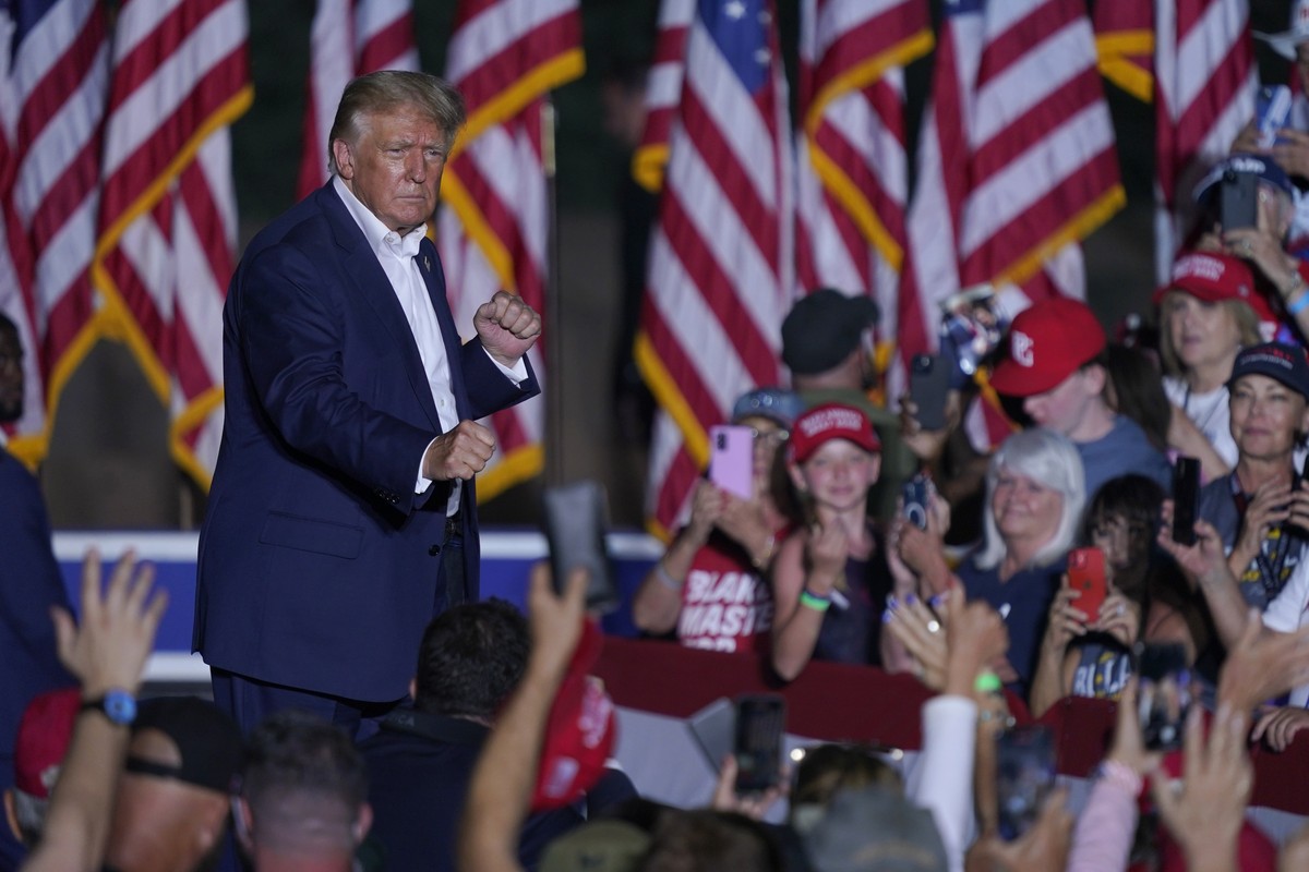 Former President Donald Trump exits the stage after speaking at a rally, Sunday, Oct. 9, 2022, in Mesa, Ariz. (AP Photo/Matt York)