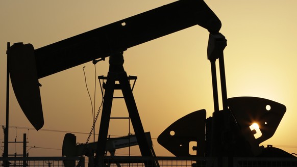 FILE -- In this Sept. 30, 2015, file photo, oil pumps work in the desert oil fields of Sakhir, Bahrain. Russias energy minister, Alexander Novak, said, Tuesday, Feb. 16, 2016, that it has agreed with ...