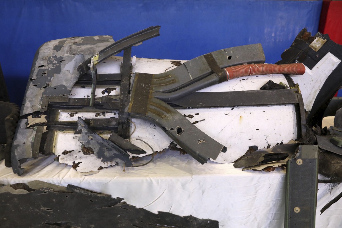 Debris from what Iran's Revolutionary Guard aerospace division describes as the U.S. drone which was shot down on Thursday is displayed in Tehran, Iran, Friday, June 21, 2019. Major airlines from ...