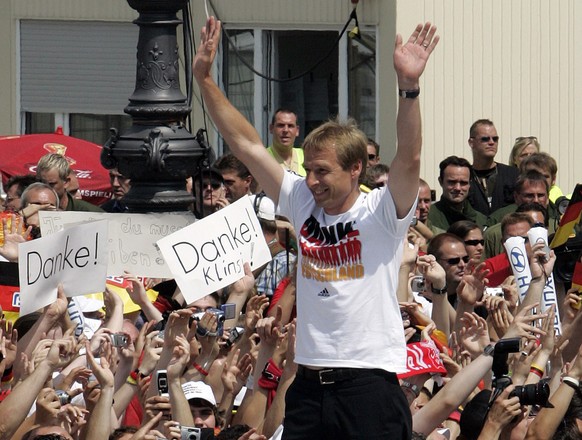 Juergen Klinsmann, head coach of Germany&#039;s national soccer team celebrates with fans at the &#039;Fan Mile&#039; in Berlin on Sunday July 9, 2006. Thousands of German soccer fans celebrate with t ...