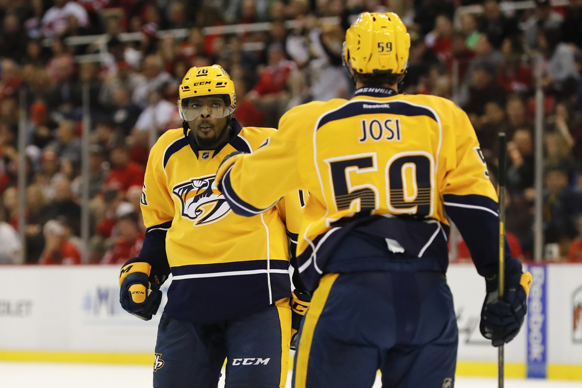 Oct 21, 2016; Detroit, MI, USA; Nashville Predators defenseman P.K. Subban (76) receives congratulations from defenseman Roman Josi (59) after scoring in the second period against Detroit Red Wings at ...