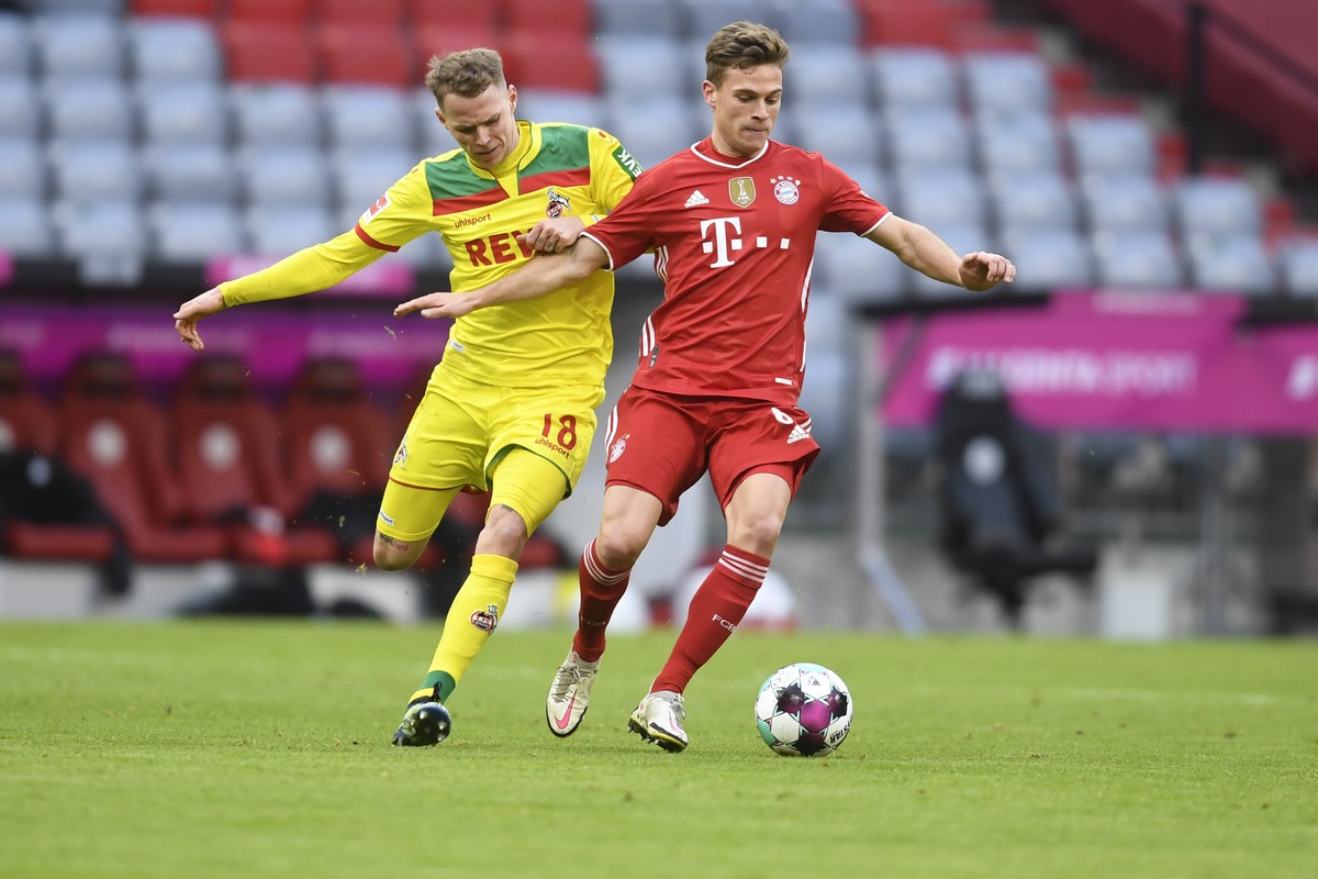 Cologne's Ondrej Duda, left, and Bayern's Joshua Kimmich challenge for the ball during a German Bundesliga soccer match between Bayern Munich and 1.FC Cologne in Munich, Germany, Saturday, F ...