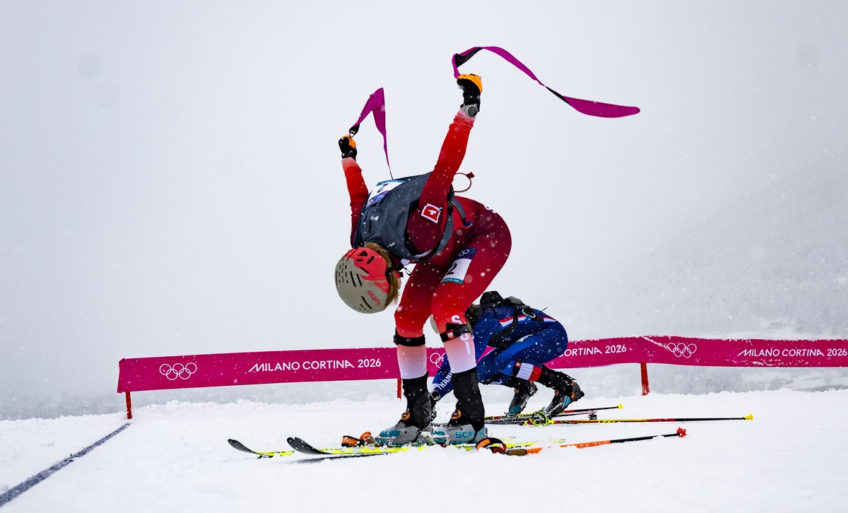 Switzerland's Marianne Fatton rips off her ski skins during the women's Ski Mountaineering sprint final at the 2026 Olympic Winter Games at the Stelvio Ski centre in Bormio, Italy, on Thursd ...
