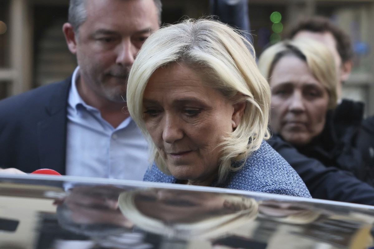 French far-right leader Marine Le Pen leaves the National Rally headquarters after a French court convicted Marine Le Pen of embezzlement and barred her from seeking public office for five years, Mond ...