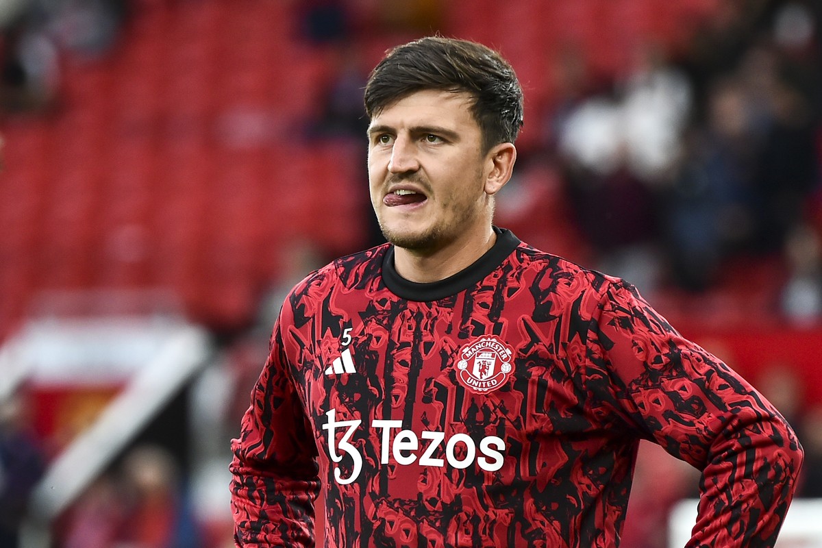 Manchester United's Harry Maguire looks on during warm up before the English Premier League soccer match between Manchester United and Wolverhampton at the Old Trafford stadium in Manchester, Eng ...