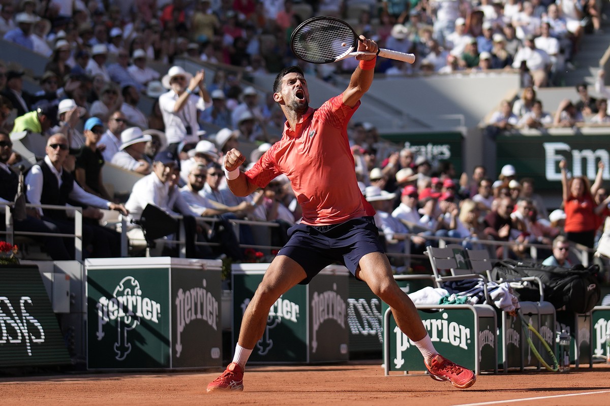 Serbia's Novak Djokovic clenches his fist after scoring a point against Spain's Alejandro Davidovich Fokina during their third round match of the French Open tennis tournament at the Roland  ...