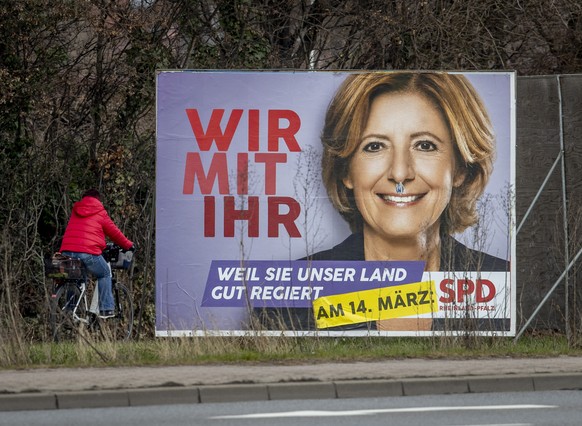 An election poster shows social democratic prime minister and top candidate for the Rhineland-Palatinate federal state elections Malu Dreyer in Frankenthal, Germany, Wednesday, March 10, 2021. The ele ...