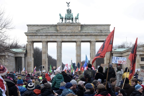 epa11076295 A protester holds a placard reading &#039;No place for Nazis&#039; during a demonstration against the far-right Alternative for Germany (AfD) party in front of the Brandenburg Gate in Berl ...