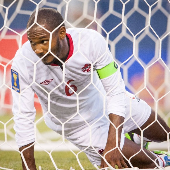 July 11, 2013 - Seattle, Washington, US - Canada s Julian De Guzman (6) looks through the goal mesh as he unsuccessfully defended against the Mexican team..Held every two years, the CONCACAF Gold Cup  ...