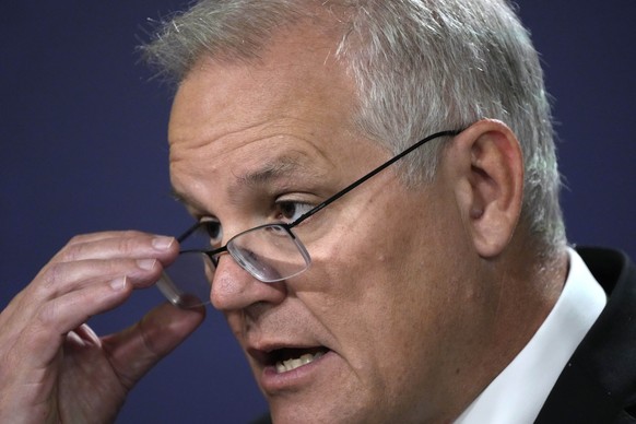 Australian Prime Minister Scott Morrison talks about the situation in Ukraine at a news conference in Sydney, Wednesday, Feb. 23, 2022. Morrison says targeted financial sanctions and travel bans would ...