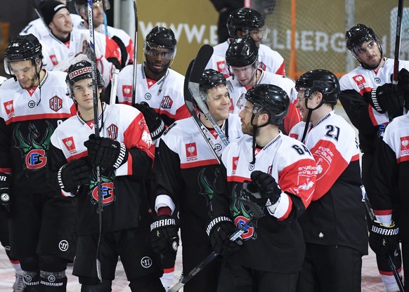 The players of Fribourg celebrate their victory after the ice hockey Champions League match 1/4 Final between HC Fribourg-Gotteron and Vitkovice Ostrava of Czech Republic, in Fribourg, Switzerland, Tu ...